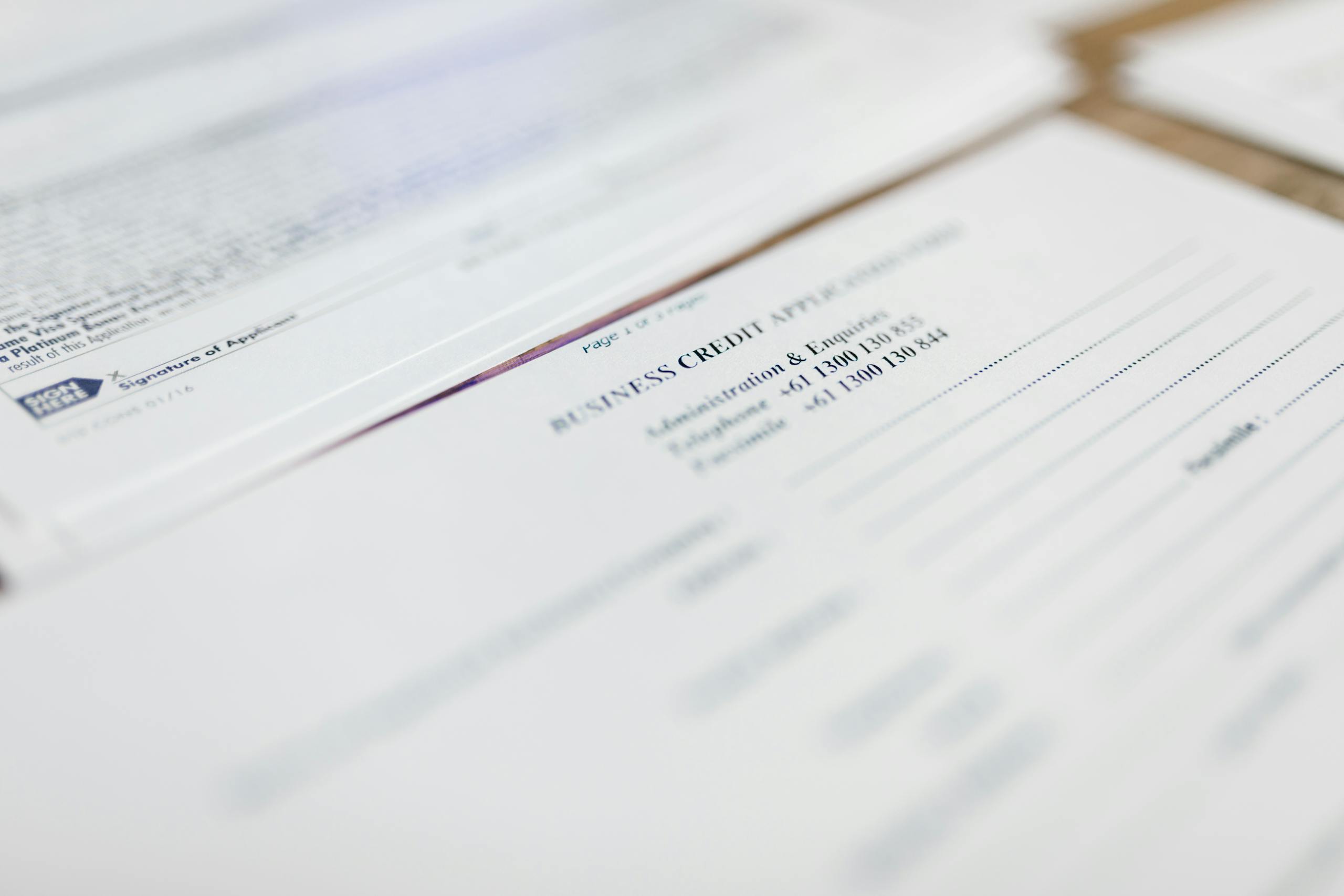 Focused image of business credit application papers, ideal for finance themes.